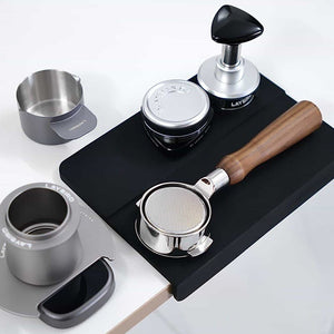 Close-up of LAYBIRD espresso tools for weighing, distributing, and tamping