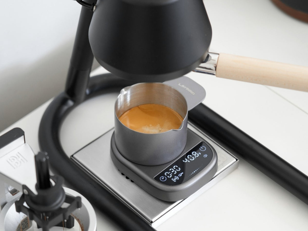 Espresso extracting into a dosing cup on the LAYBIRD MagAttach coffee scale