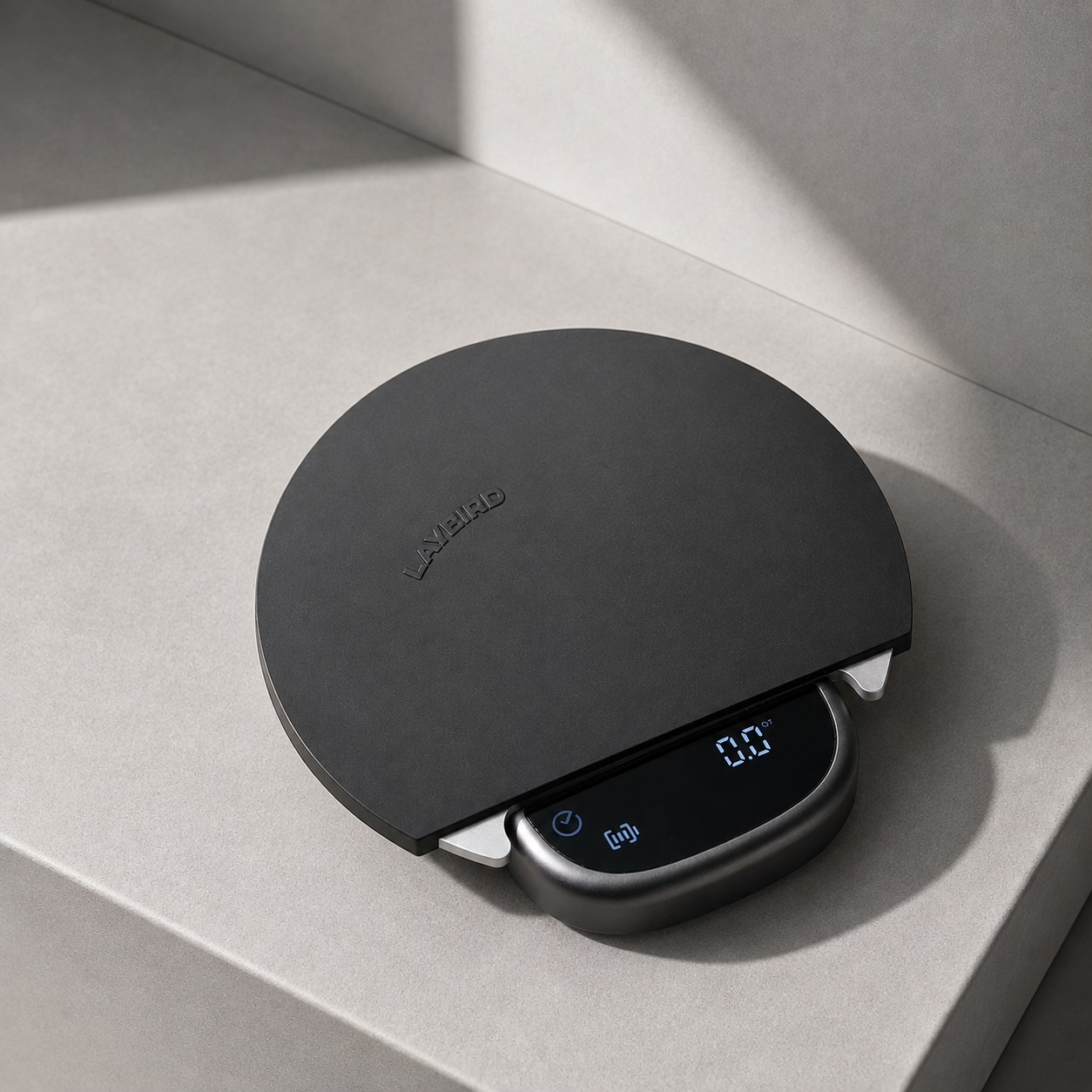 MagAttach coffee scale with a black silicone platform pad on a light countertop