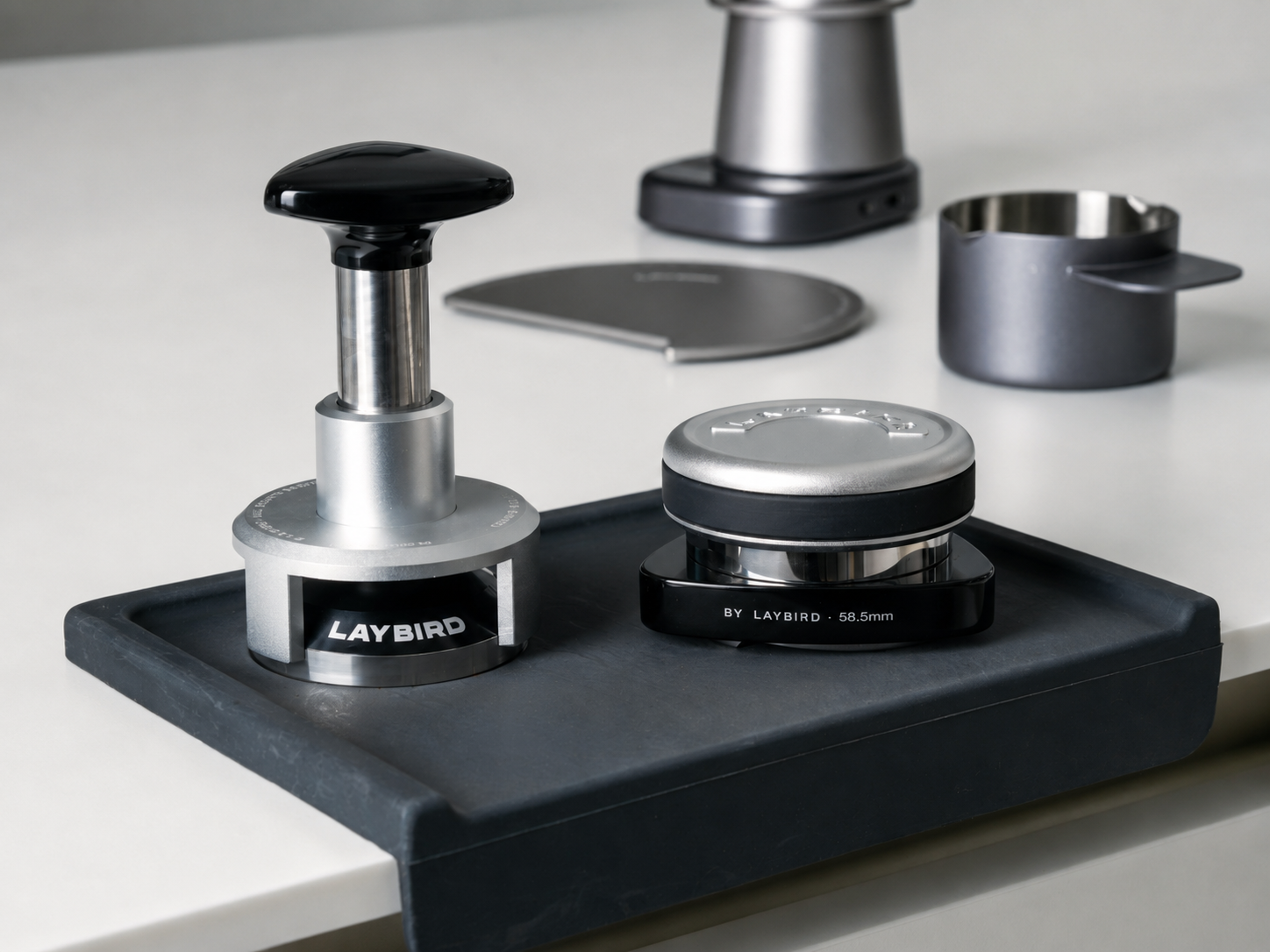 LAYBIRD TriSpin coffee distributor and TriPress pressure tamper in an espresso puck prep workflow