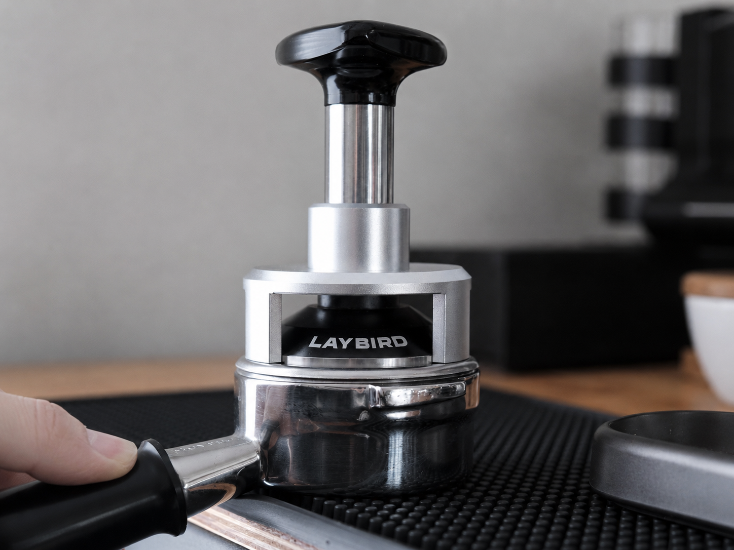 LAYBIRD TriPress leveling guard resting evenly on an espresso basket