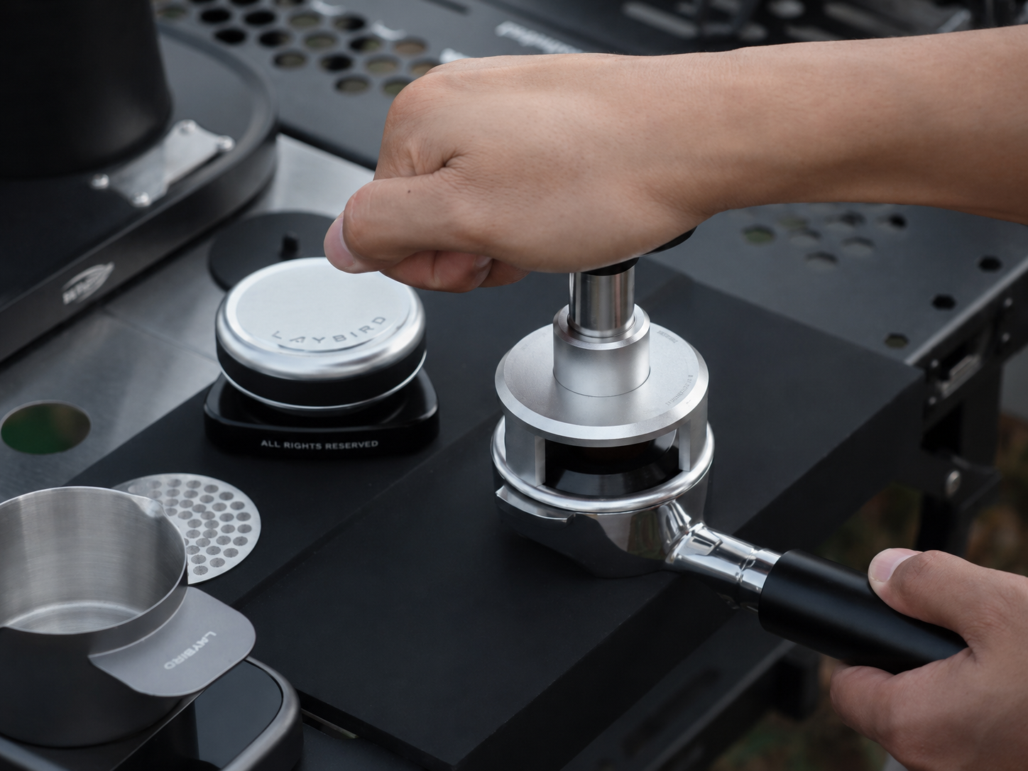 TriPress 25lb pressure tamper used after coffee distribution